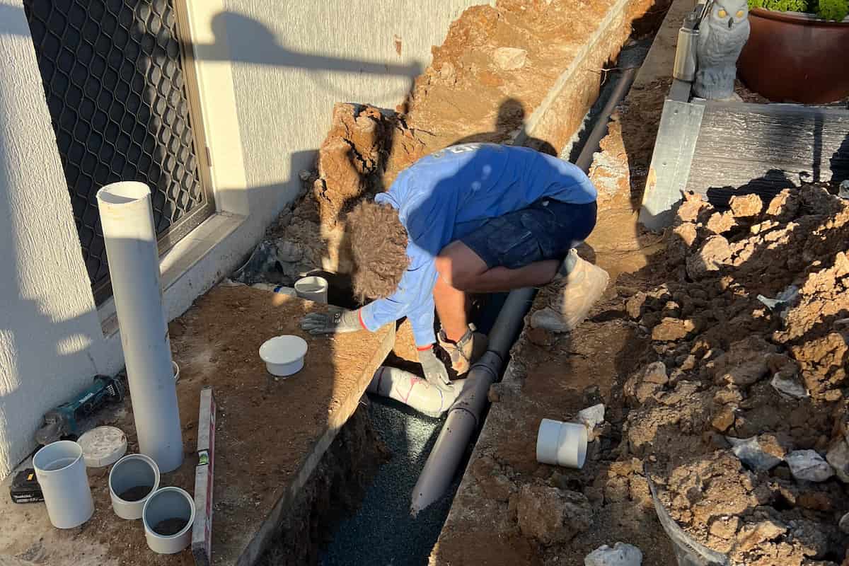 Coffison Plumbing technician preparing a stormwater pipe for relining at a residential Brisbane property.