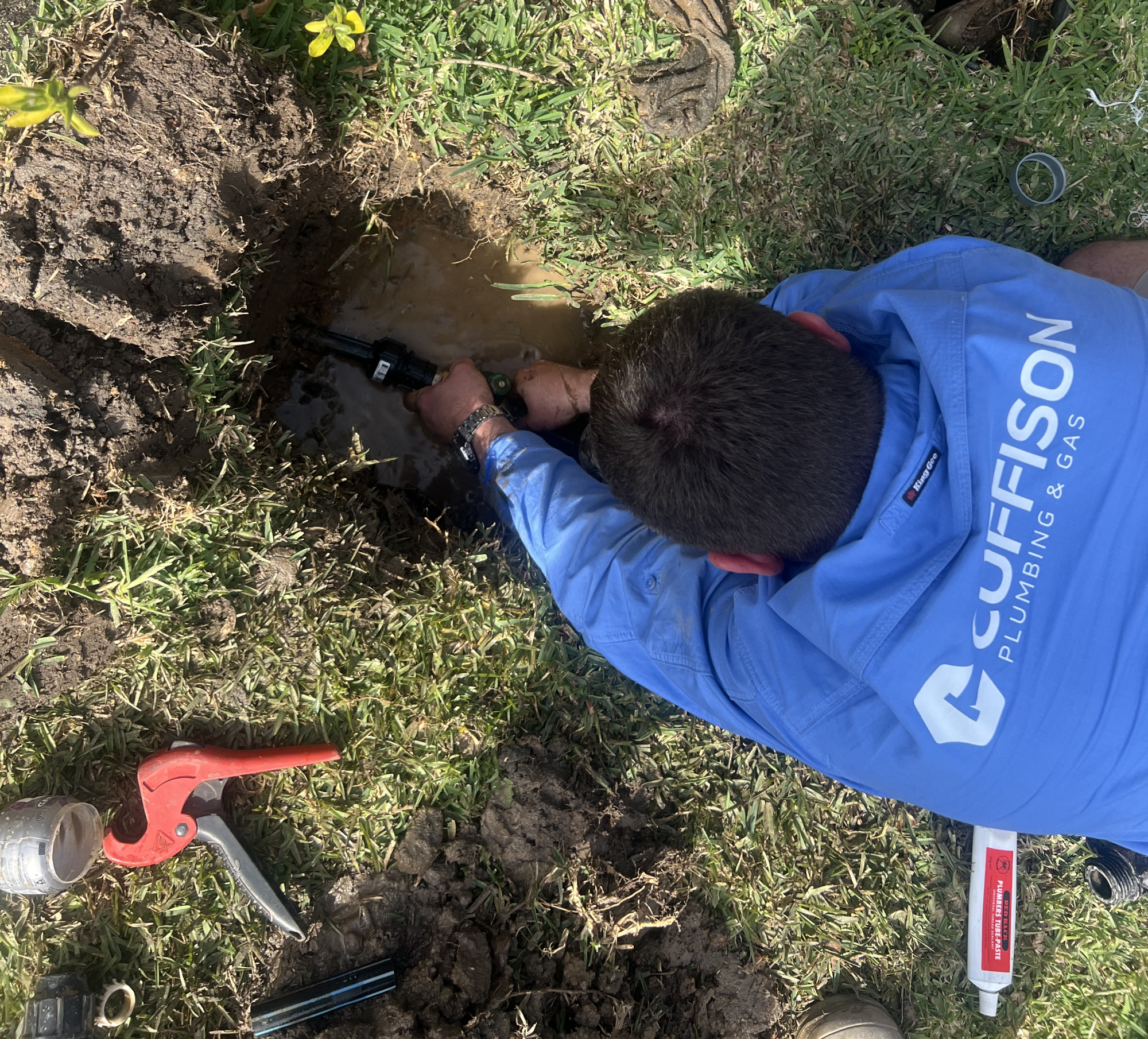 professional plumber repairing residential plumbing system on site